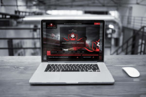 A laptop displaying the Asian Football Awards website home page