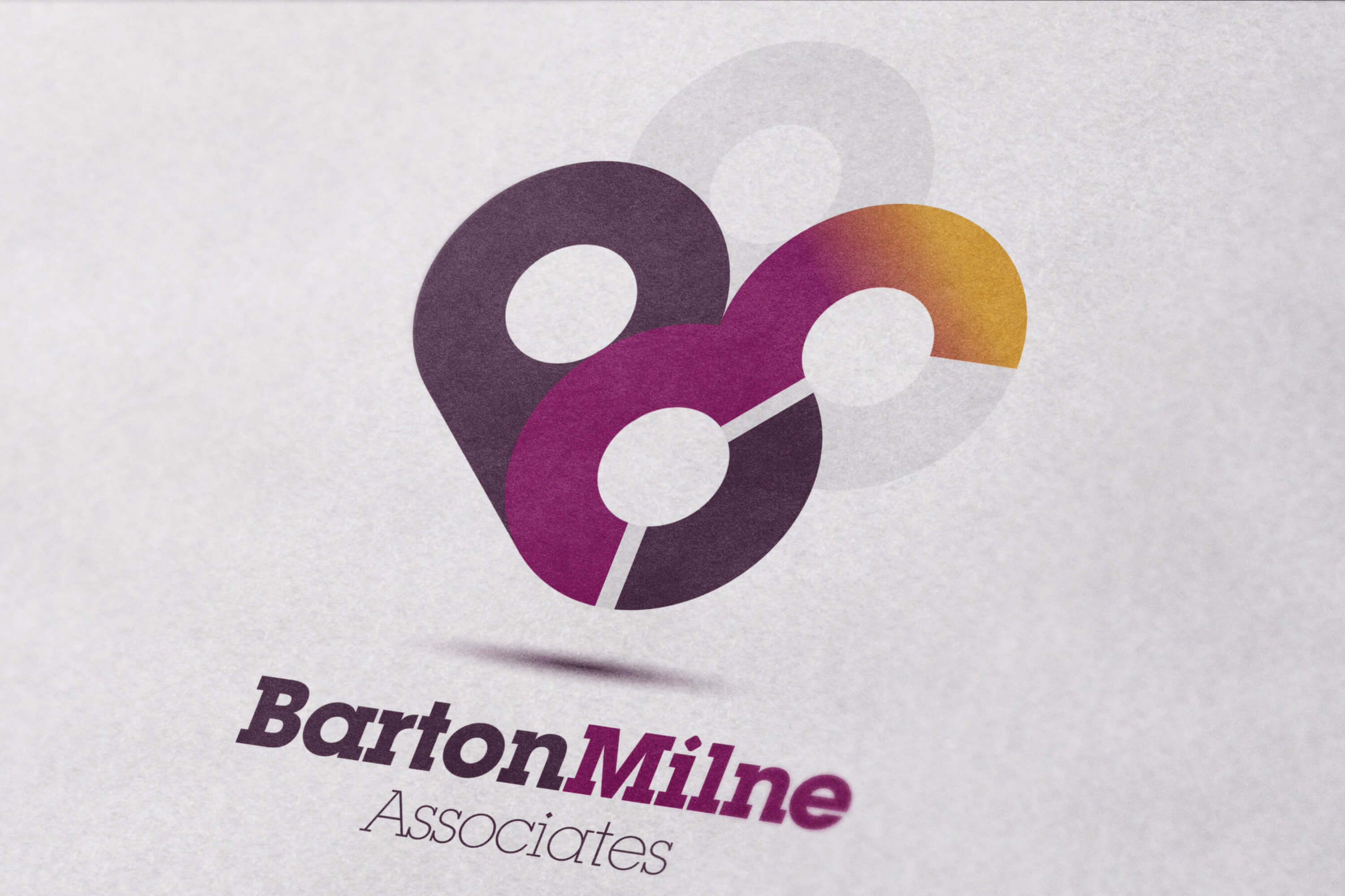 A close up of the Barton Milne Associates colour logo on white page