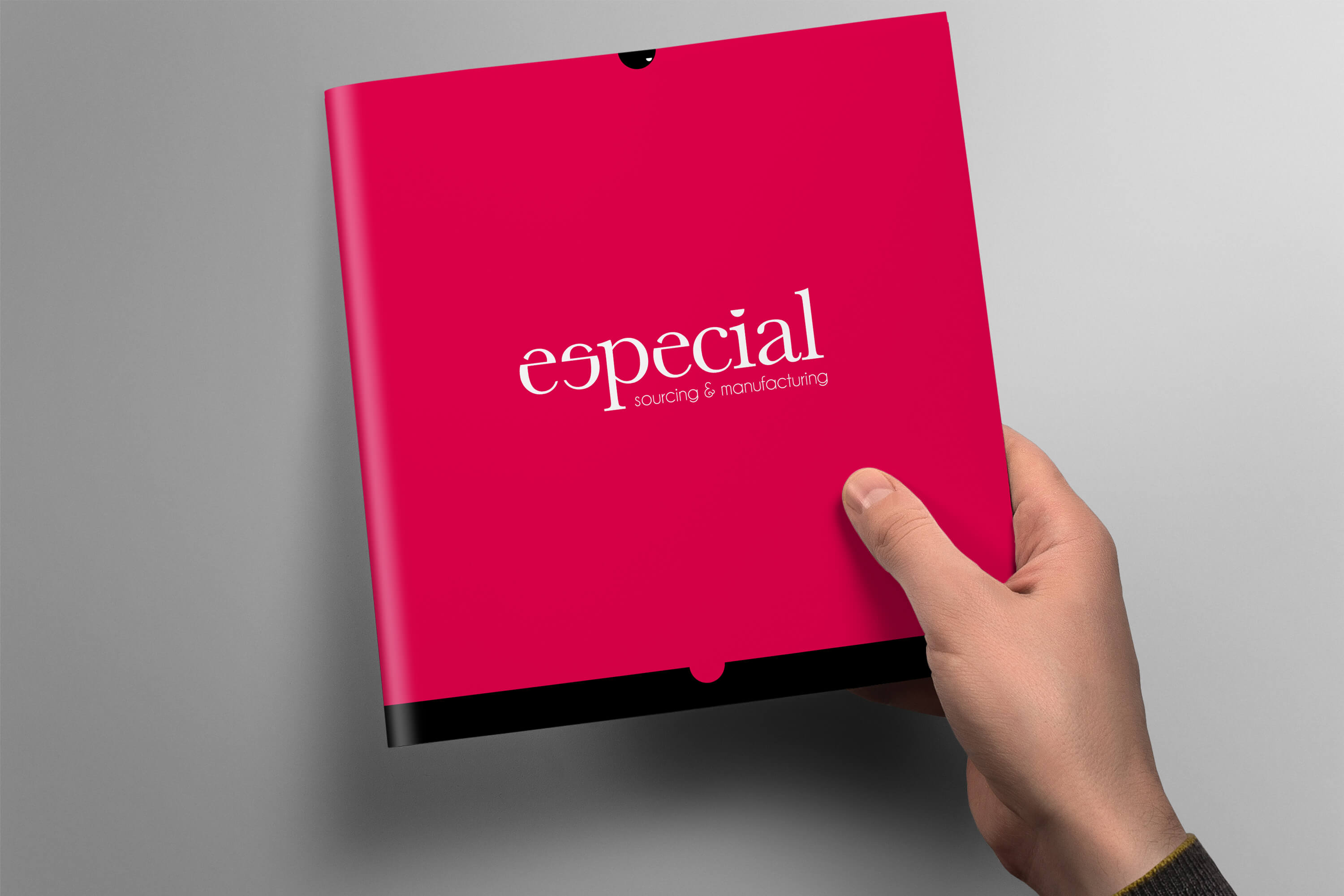 Hand holding an Especial Sourcing and Manufacturing brochure to show the cover