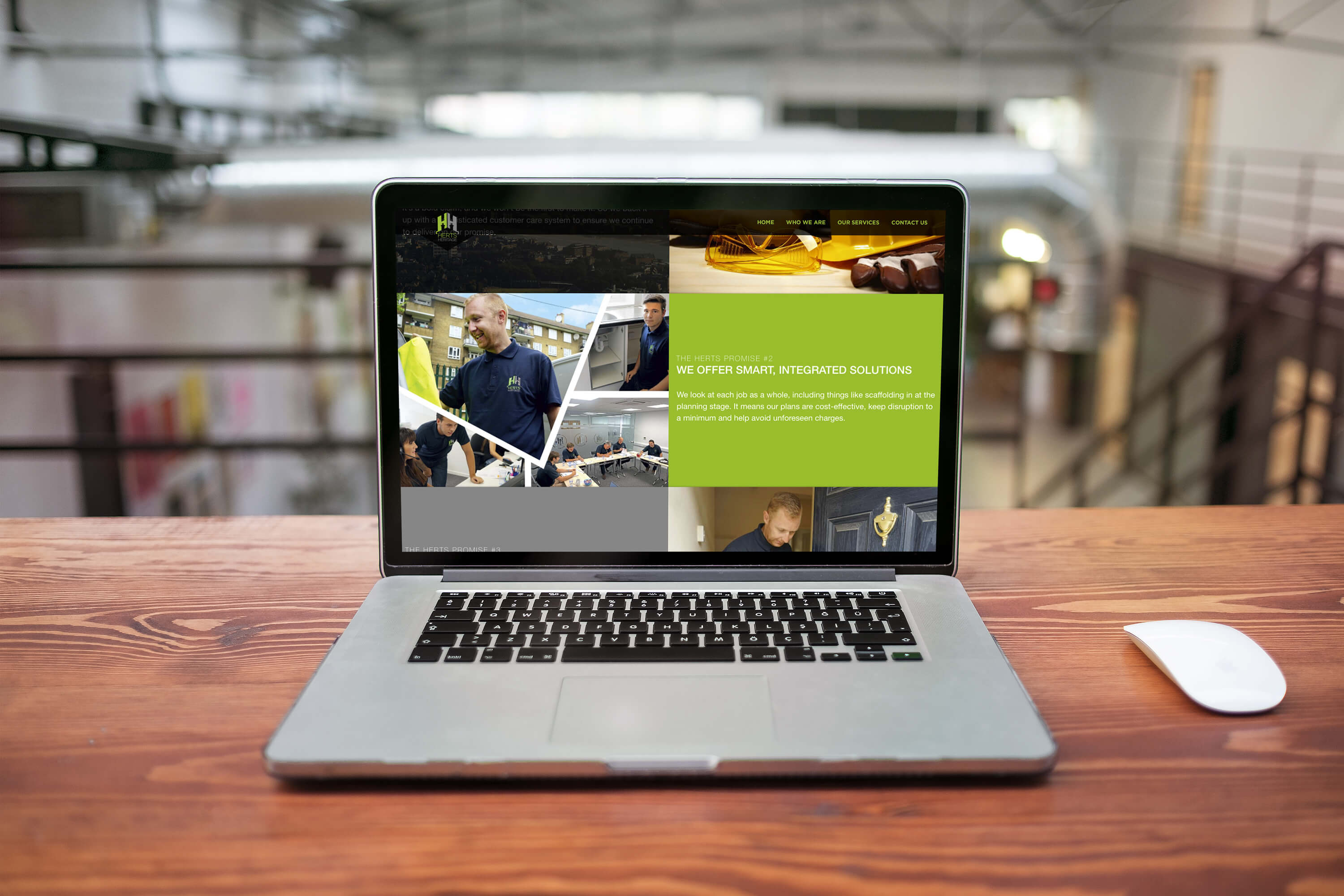 Laptop on a desk showing a section of the rebranded Herts Heritage website home page