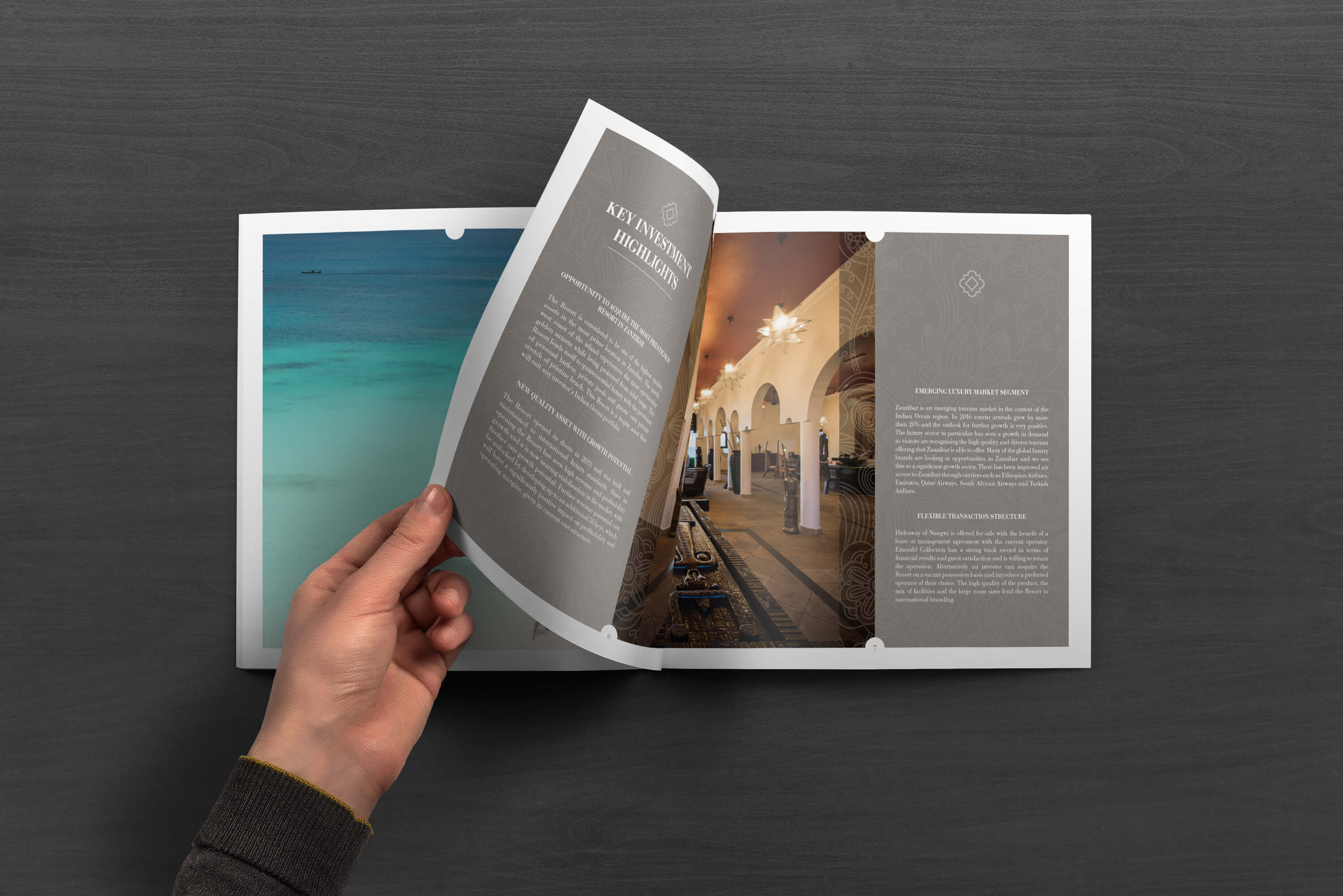 Person turning pages of the JLL Emerald Resorts corporate brochure