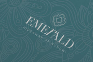 Close up of the JLL Emerald Resorts corporate brochure logo design