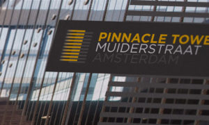 Close up of the JLL Pinnacle Tower logo and branding