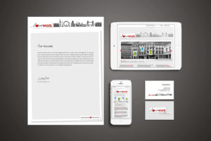 Photo showing Lovework brand identity on letterhead, business cards and website design on iPhone and iPad