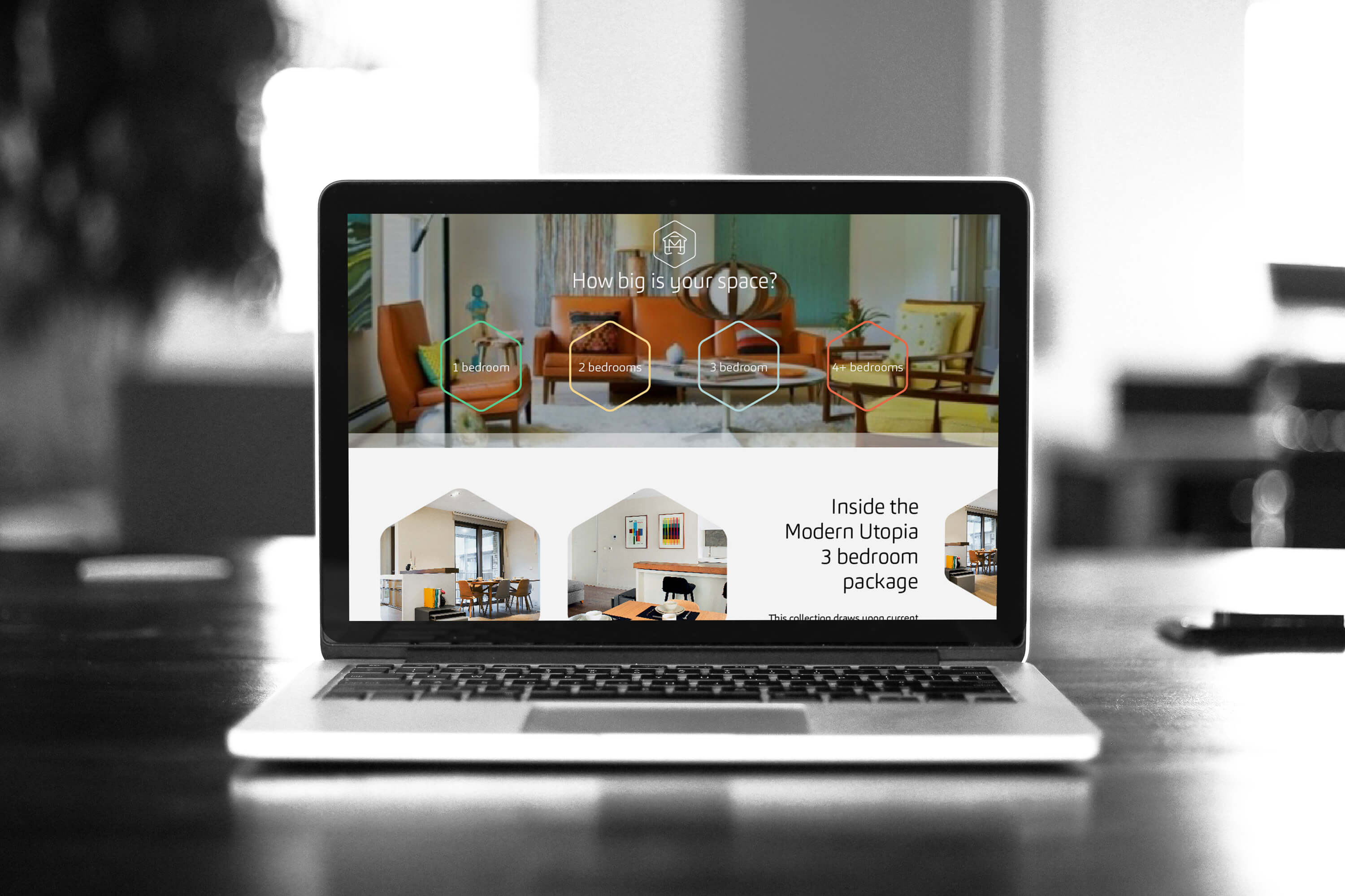 Laptop showing the packages page on the Make My House Home website