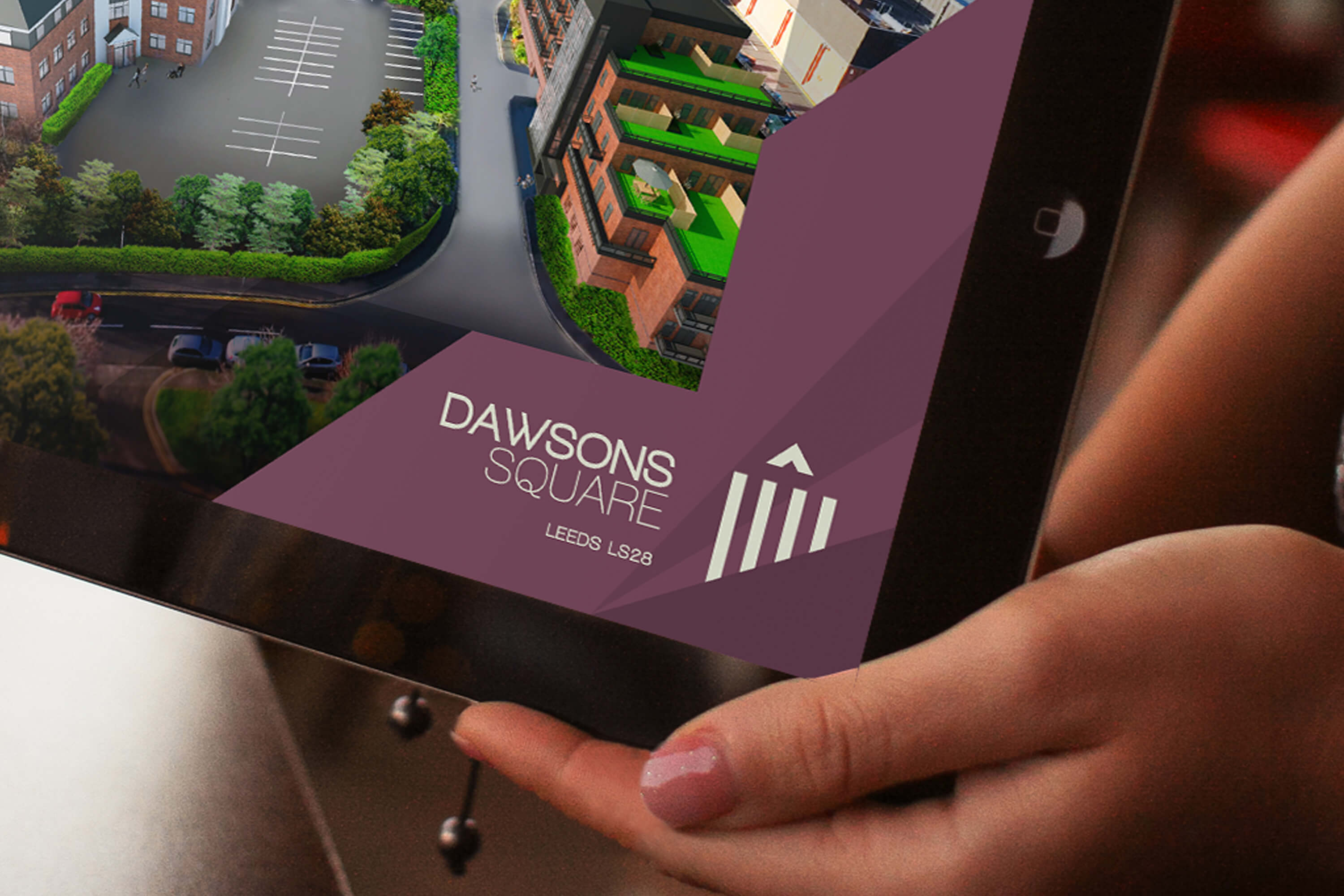 Close up of a tablet corner, showing the Dawsons Square brand design