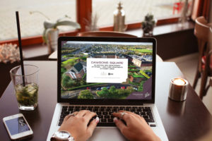 Laptop showing the Dawsons Square branded website