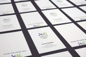 Multiple cards displaying the Sprout People brand identity on the front and back of business cards