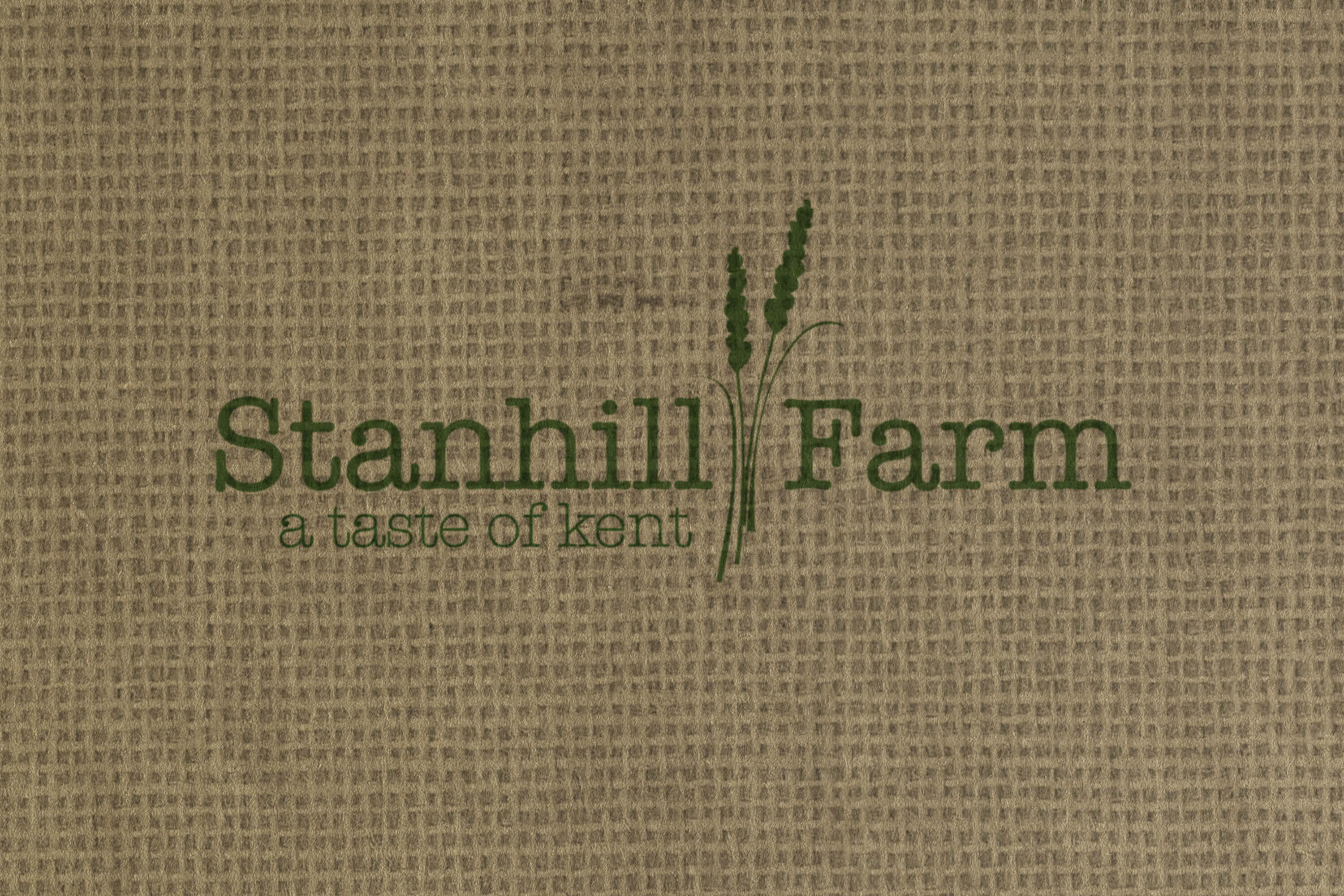 Stanhill Farm logo design printed on a hessian background