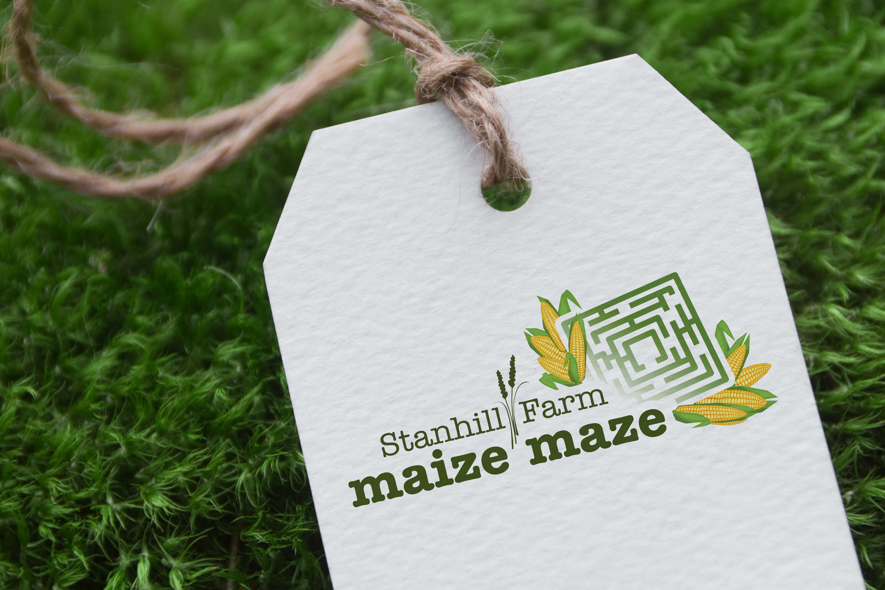 Paper tag showing the Stanhill Farm Maize Maze logo design