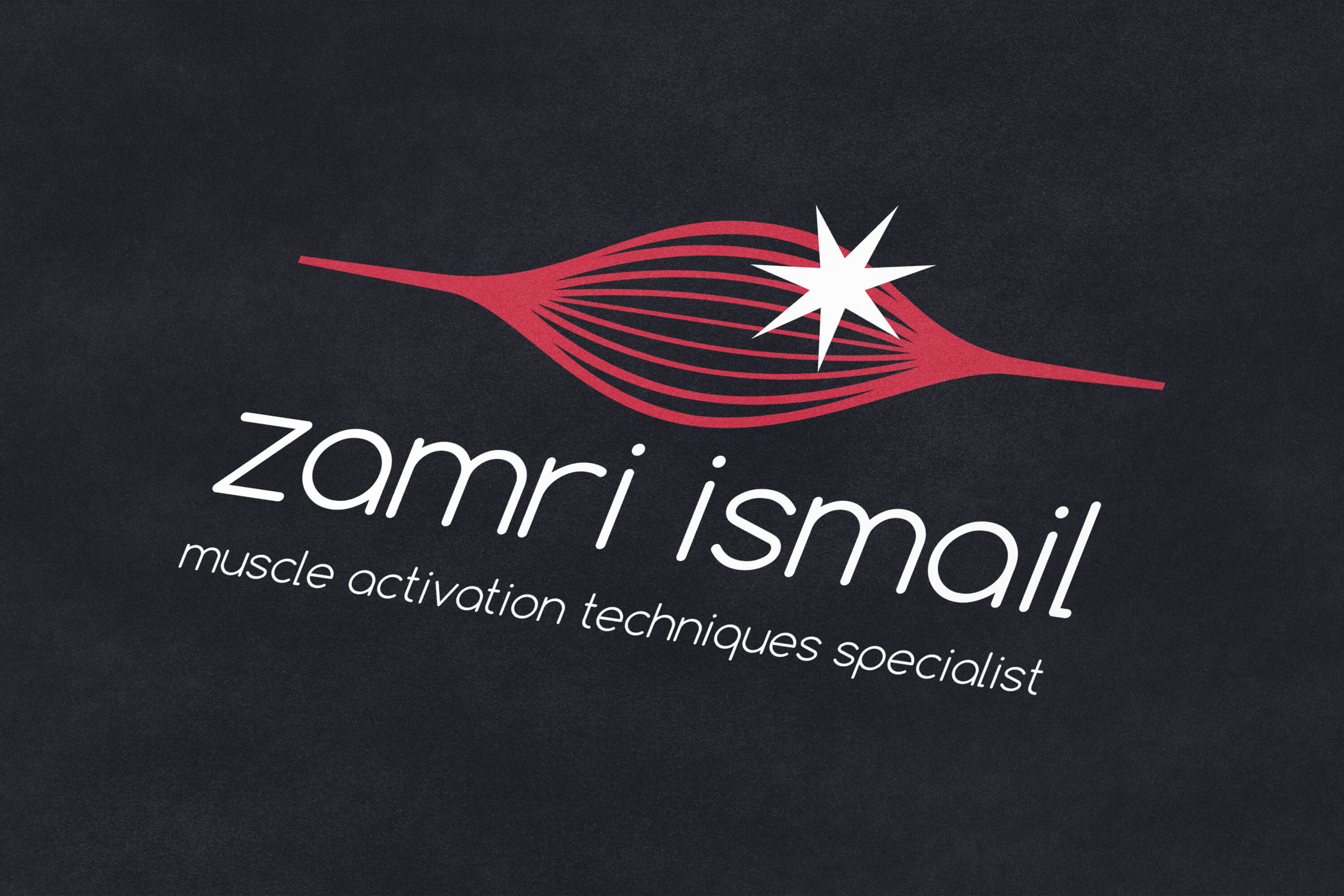 Zamri Ismail logo design on dark paper background