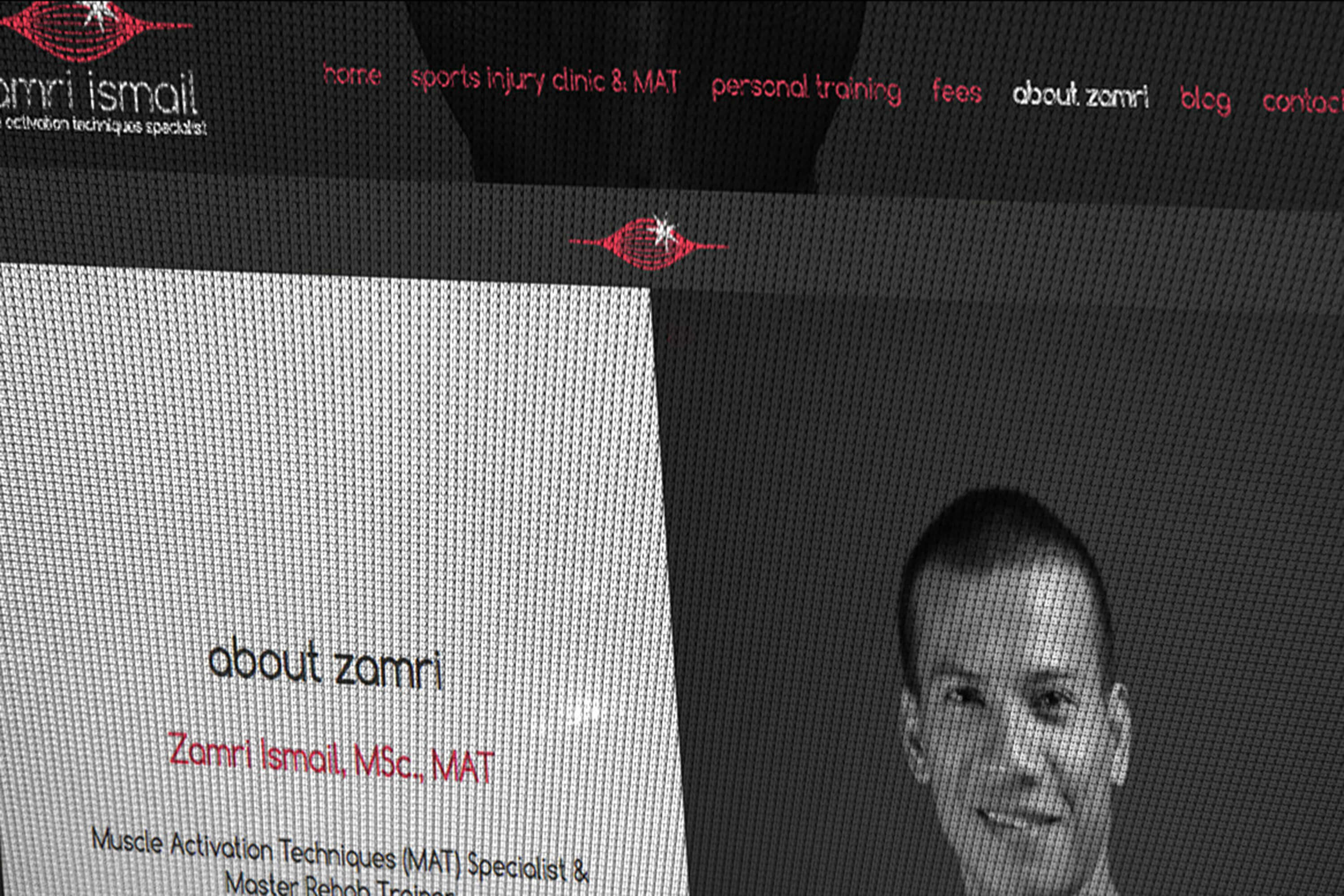 Close up detail of the Zamri Ismail website as it appears on screen